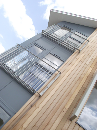 grey metal and wooden apartments front